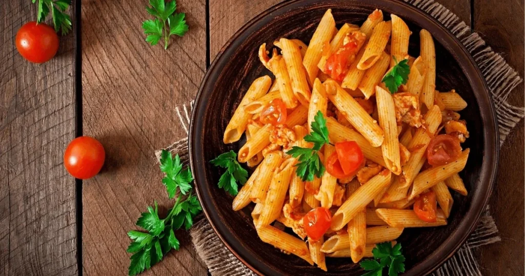 Plate of Barilla Protein Pasta with fresh vegetables and sauce, showcasing a healthy, protein-packed meal option