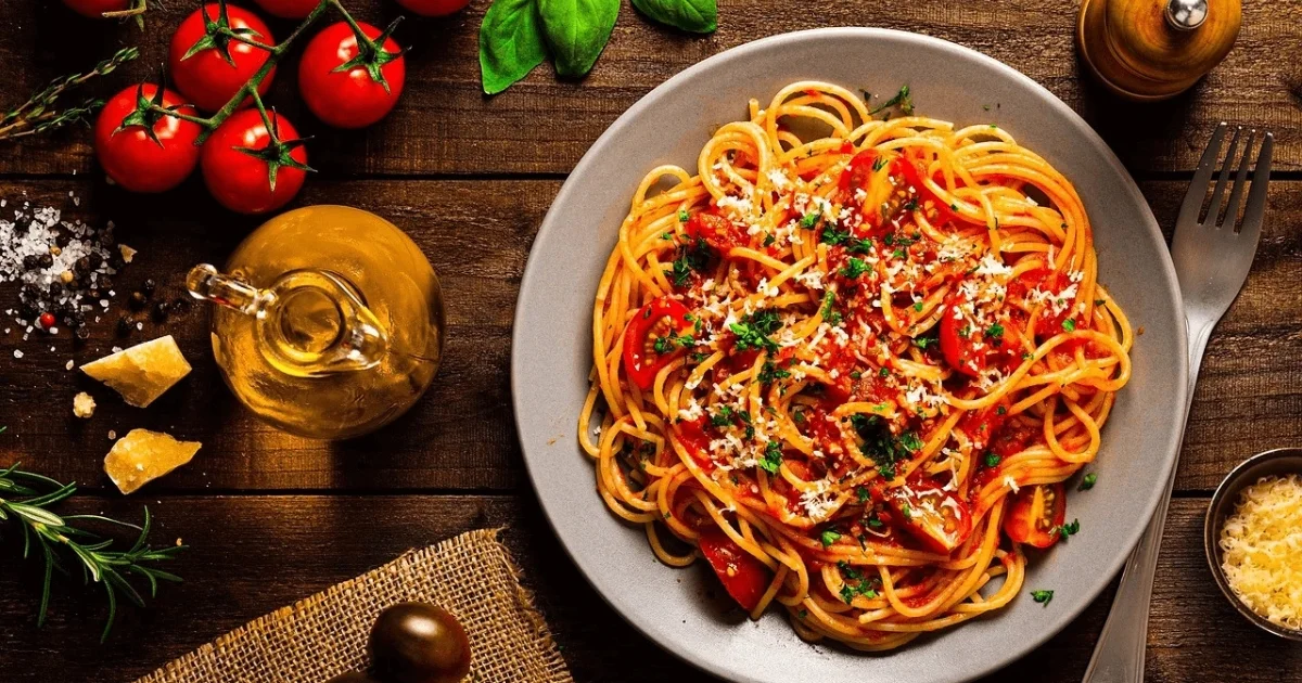 Plate of Barilla Protein Pasta with fresh vegetables and sauce, showcasing a healthy, protein-packed meal option