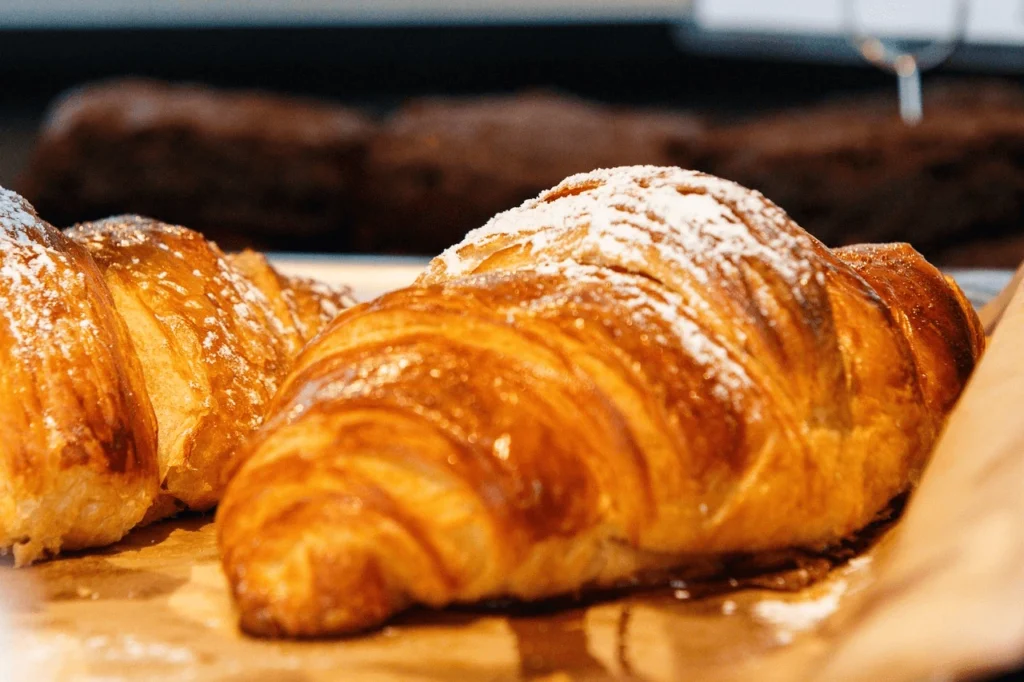 Freshly baked homemade croissants with golden, flaky layers, perfect for breakfast or brunch