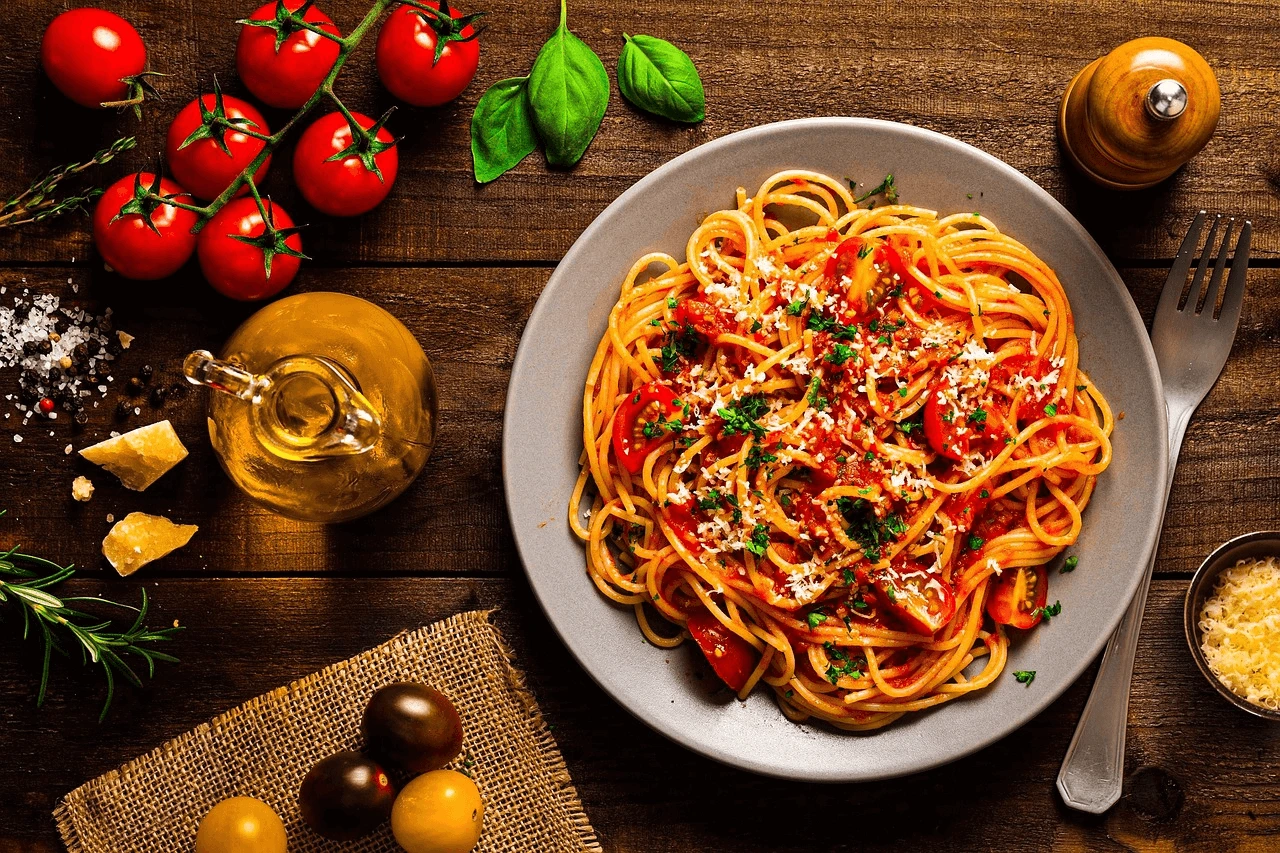 Plate of Barilla Protein Pasta with fresh vegetables and sauce, showcasing a healthy, protein-packed meal option