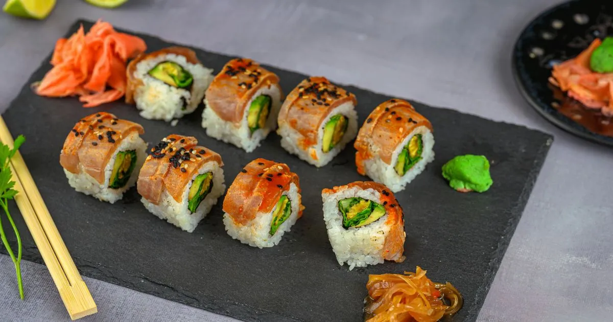 lobster roll recipe served in a buttery toasted bun with fresh lobster meat and lemon wedges