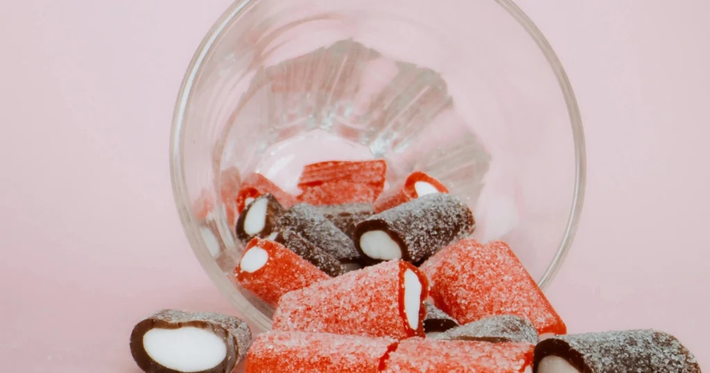 Garnished pink gelatin trick dessert with strawberries and mint
