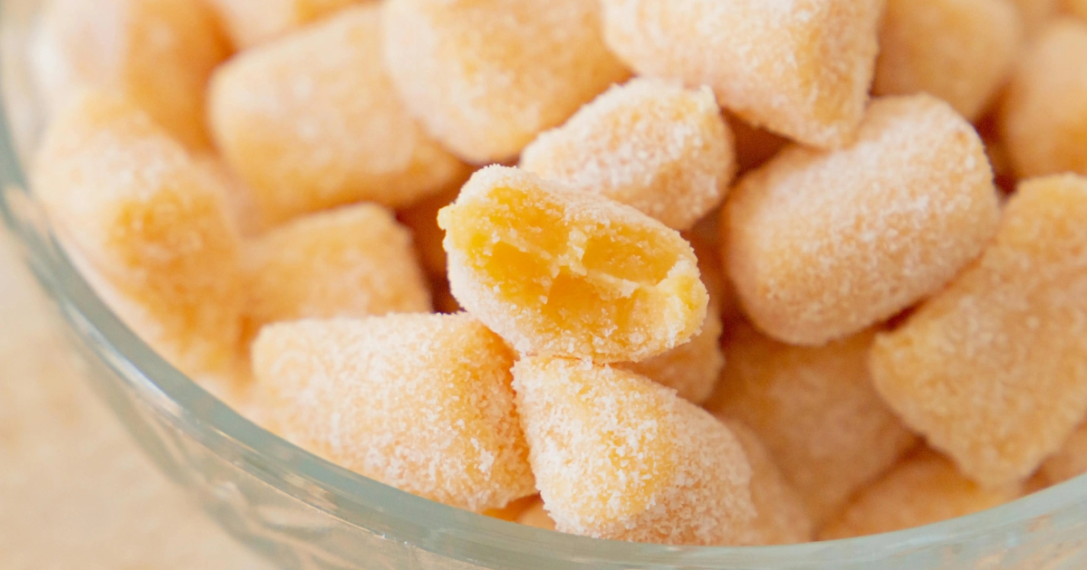 Mixing pink gelatin trick recipe ingredients in a bowl