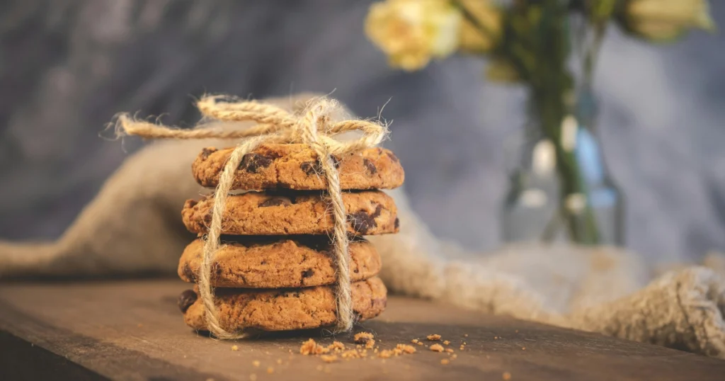 Homemade chocolate oat cookies made without butter displayed on a wooden table