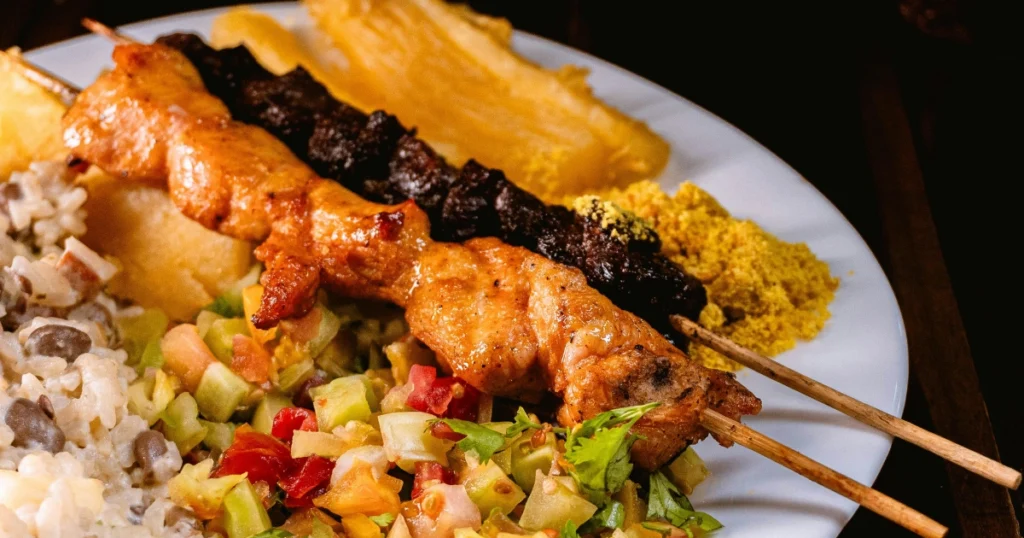 Flat lay of simple chicken marinade ingredients including garlic, olive oil, lemon, and spices.