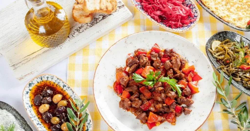 Close-up of beef tips coated in thick brown gravy served over rice.