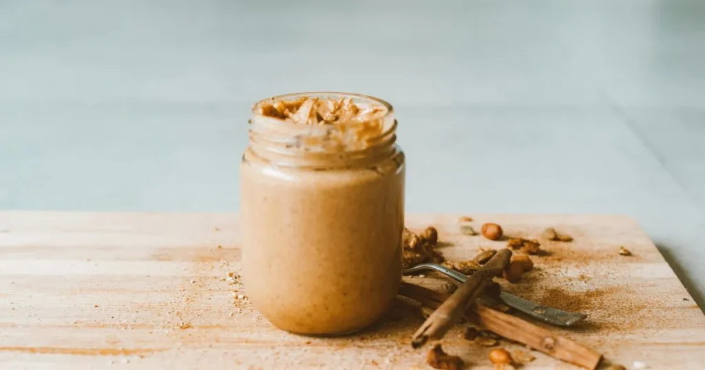 A spoonful of smooth vegan caramel sauce made from blended dates.