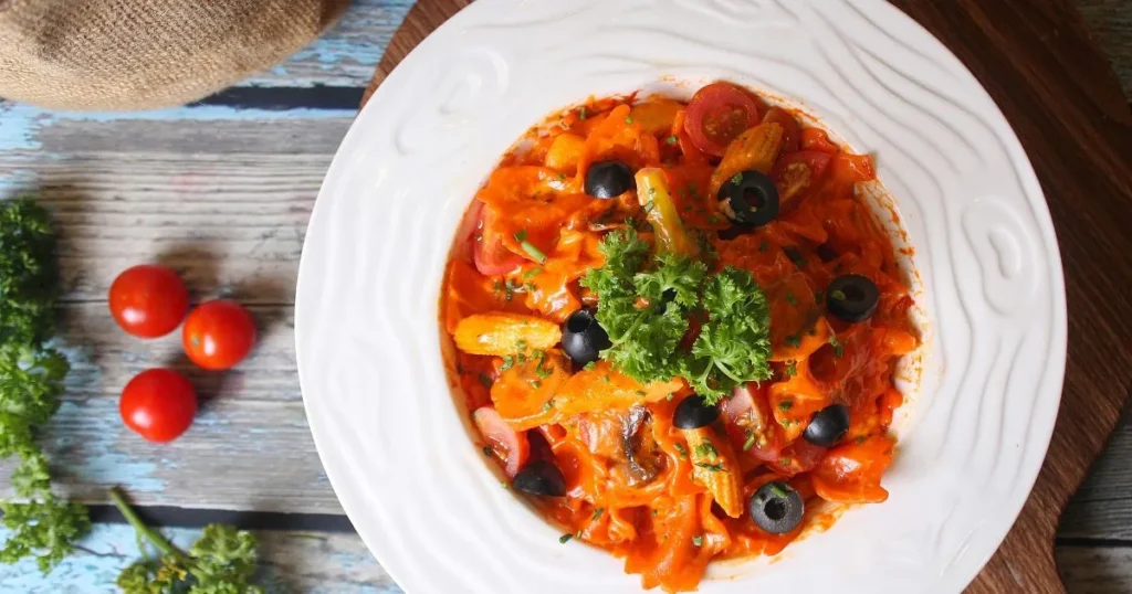 One-pan creamy Cajun pasta with sliced sausage and bell peppers in creamy sauce.