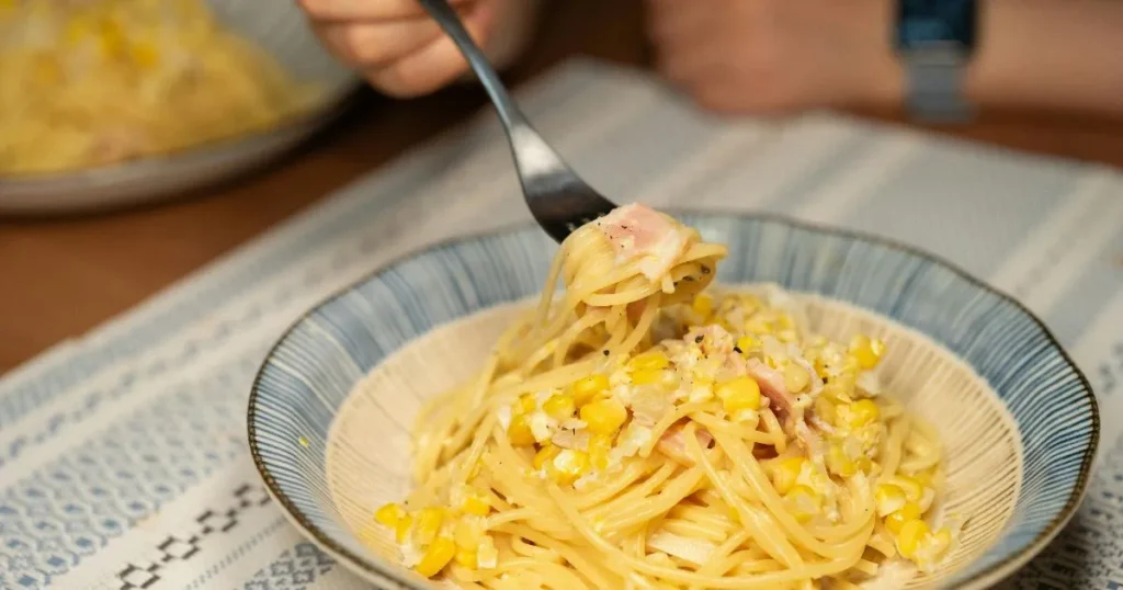 Cheesy and creamy pasta recipe with roasted corn and bright lime flavor.