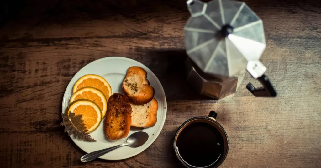 Golden toasted bread topped with fresh tomato mixture and eggs served as a quick Spanish breakfast with olive oil and herbs.